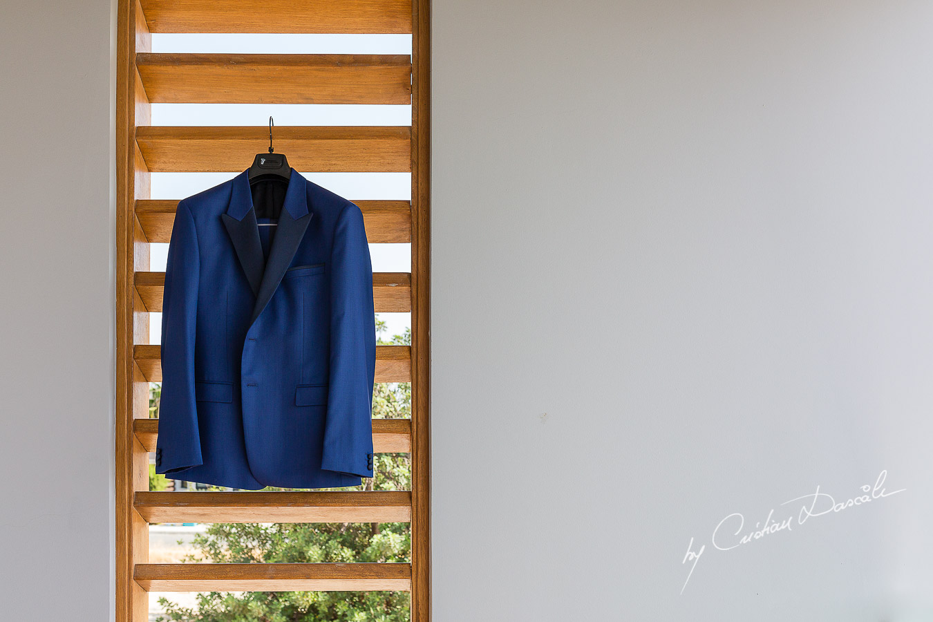 Groom's suit captured at an elegant and romantic wedding at Elias Beach Hotel by Cristian Dascalu.