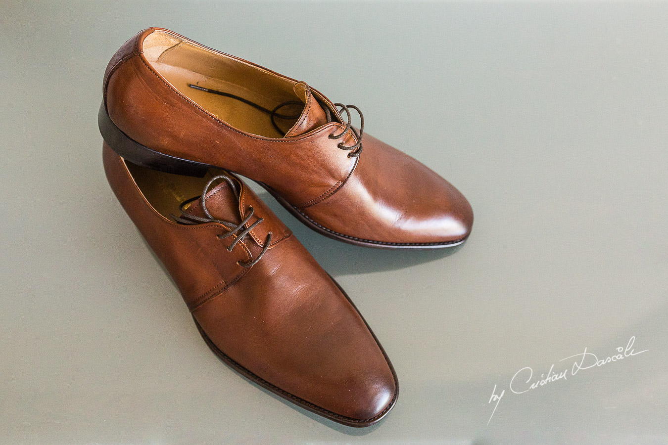 Groom's shoes captured at an elegant and romantic wedding at Elias Beach Hotel by Cristian Dascalu.